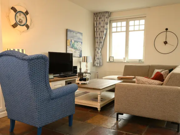 Appartement duindoorn 301 cadzand woonkamer stoel