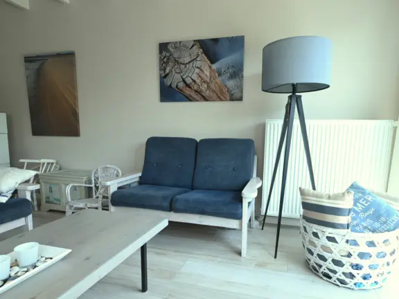 Vakantiehuisje cadzand sincfal 16 woonkamer bank