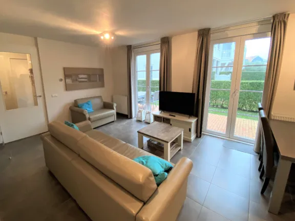 Duinhof 5 6 appartement cadzand woonkamer zithoek