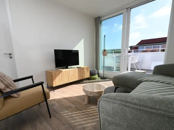 Luxe appartement boulevard 15 301 cadzand woonkamer en dakterras