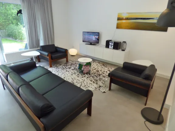 Vakantie bungalow nachtegalenstraat 13 cadzand woonkamer bank