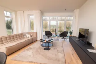 Vakantie appartement boulevard de wielingen 15 001 cadzand woonkamer zithoek totaal