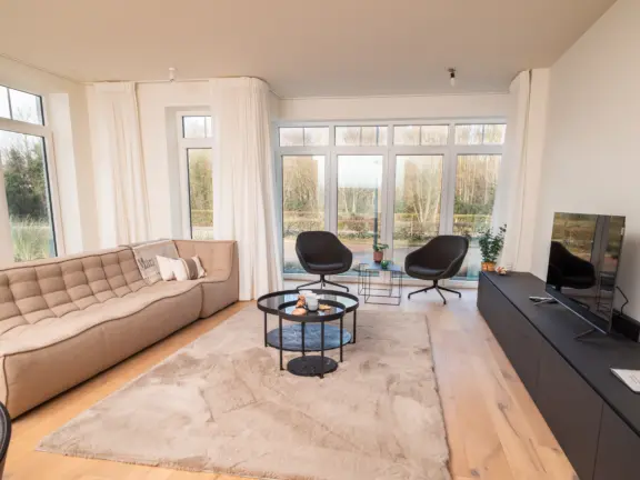 Vakantie appartement boulevard de wielingen 15 001 cadzand woonkamer zithoek totaal